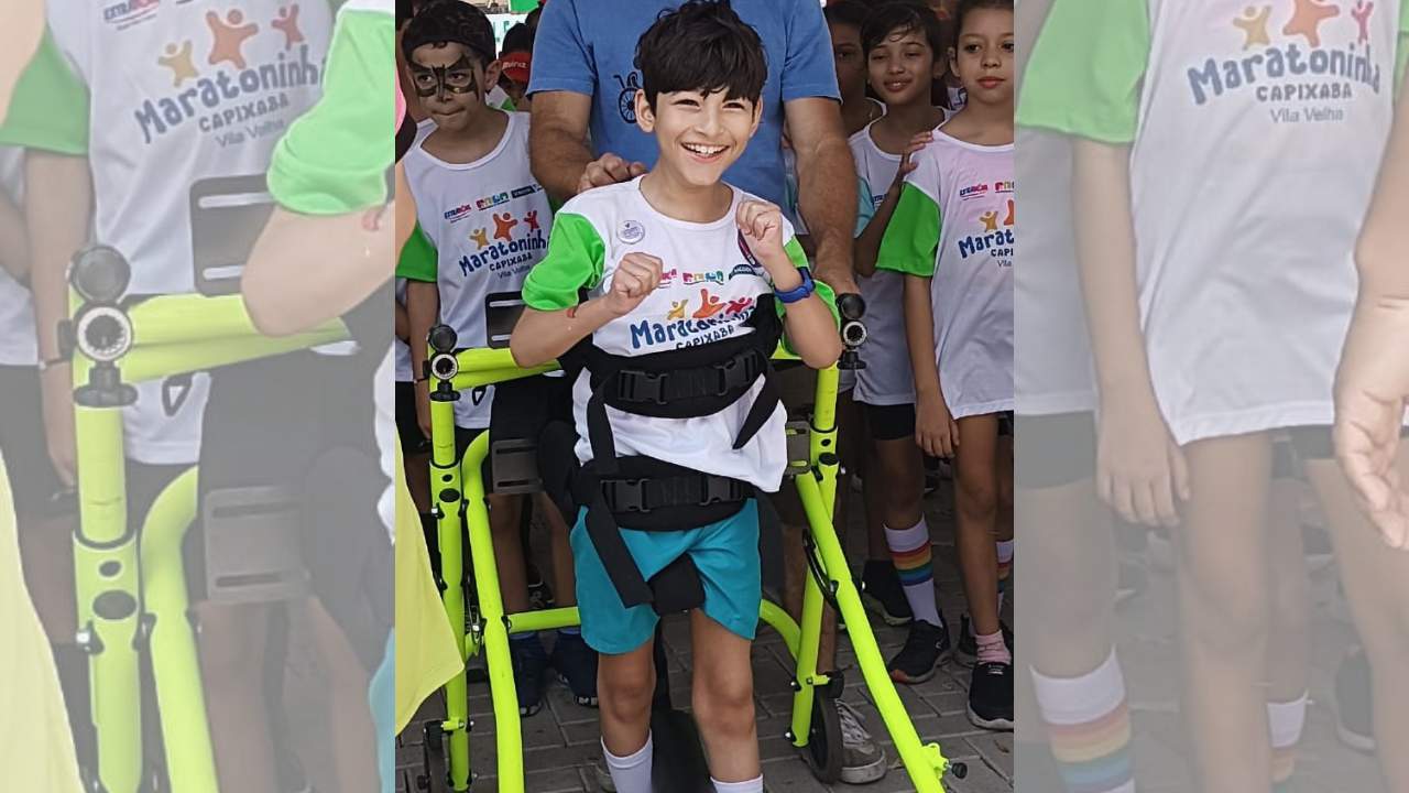 Criança que tem paralisia cerebral corre maratoninha e torcida vibra